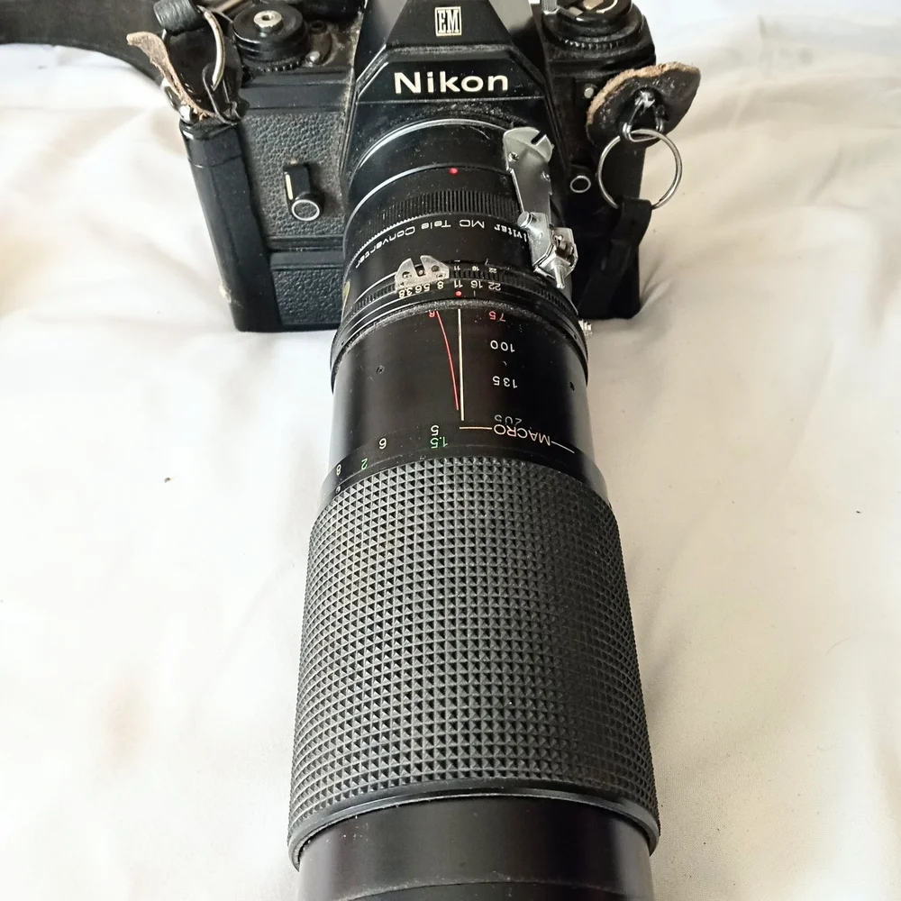 Nikon SLR Camera and Lens Kit with Tan Carry Bag and Black Body